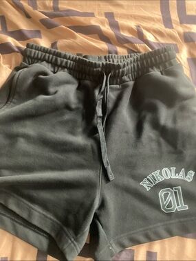 Black Men's Jean-Style Shorts with 'Nikolas 01' Graphic